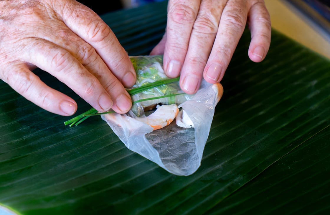 Close,Up,Of,Female,Hands,Making,Fresh,Spring,Rolls,