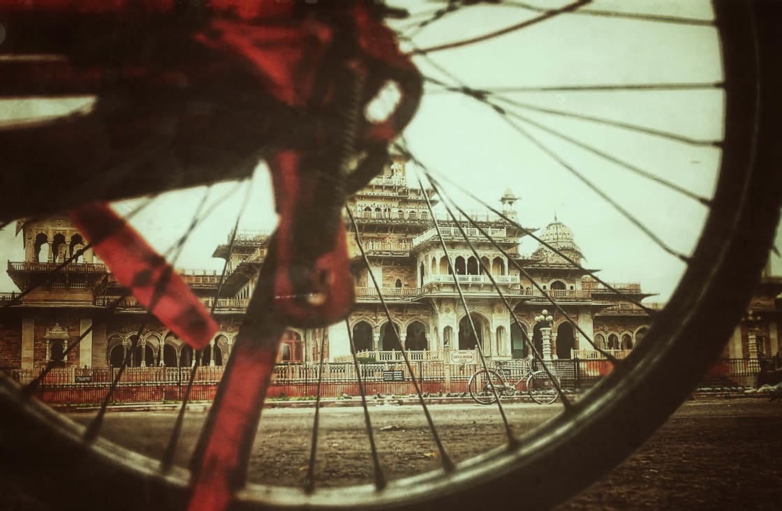 View through spokes of bicycle on cycling tour in Jaipur