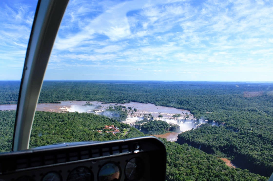 Tourists Flying Over Iguazu Falls By Helicopter In Iguaçu National