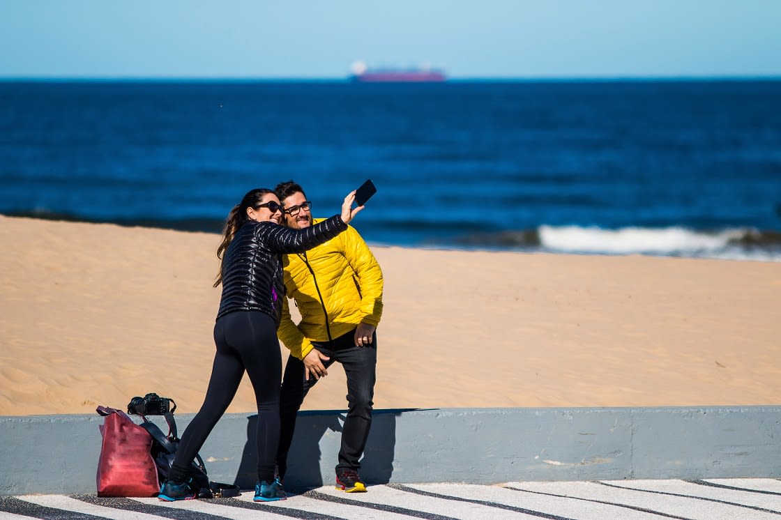 Couple Making Photos On Punta Del Este Beach