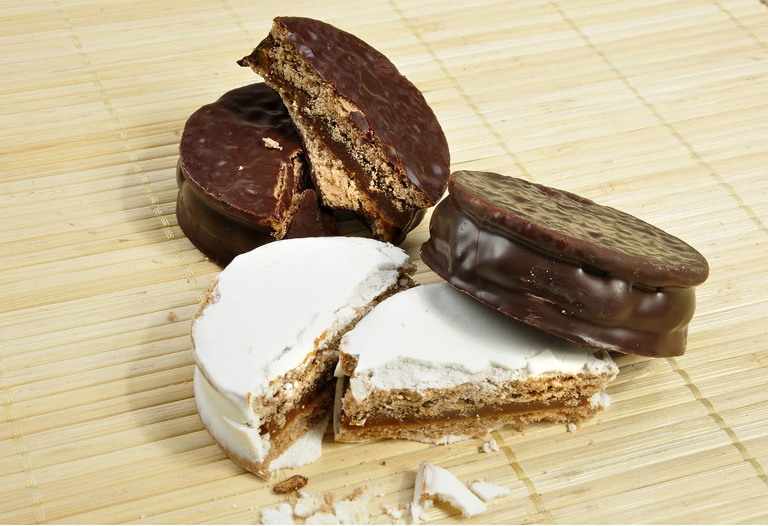 Alfajor Of Chocolate And Powederd With Sugar on a bamboo mat