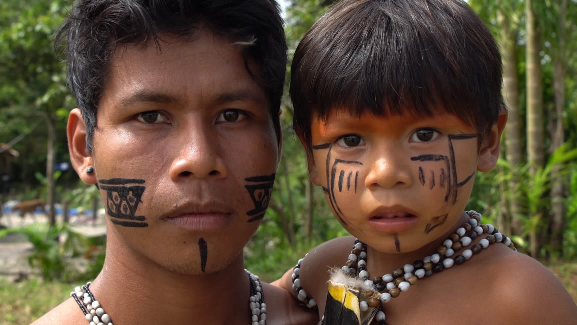 Father And Son At An Indigenous Tribe In The Amazon