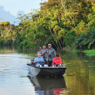 Cruise passengers on a skiff boat during the excursion