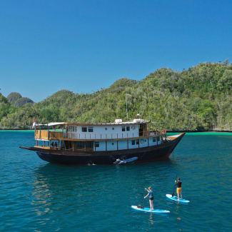 Paddle boarding nearby the ship