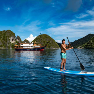 Young boy paddle boarding