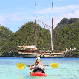 Kayaking nearby the ship