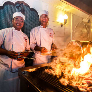 Chefs by the barbecue onboard Jahan