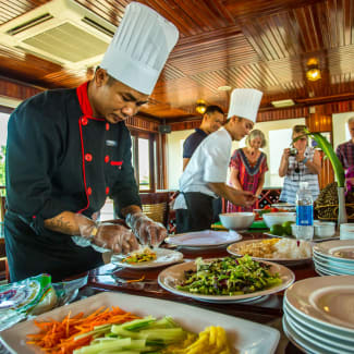 Chef and passengers during the cooking demo