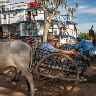 Ox carts by the river