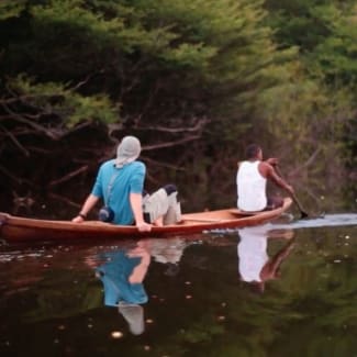 People canoeing the Amazon