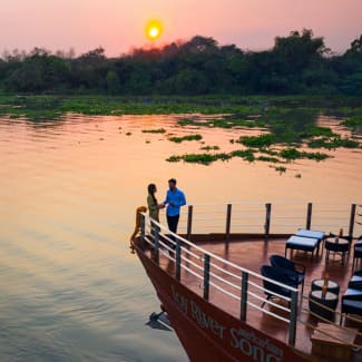 A couple on the bow at sunset