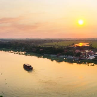 Distant Ship on the river at sunset