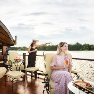 Two women on a terrace, looking out