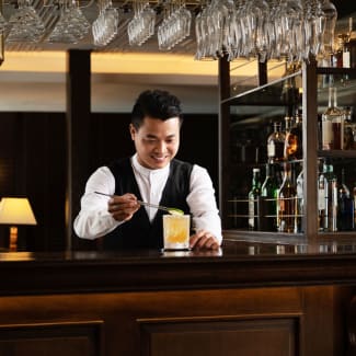 Barman pouring a drink