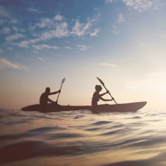 Two people in the kayak at sea