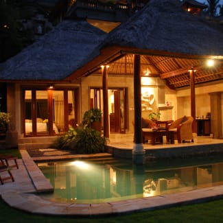 Villa with small pool at night
