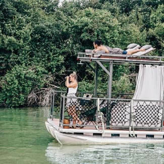 A couple on a small river boat