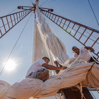 Crew working with sails