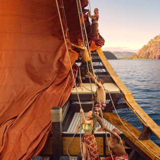 People rigging the sails