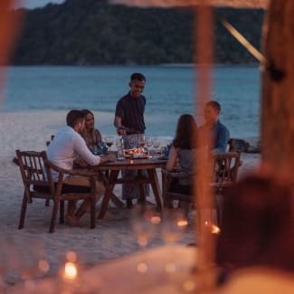 People having dinner on the beach