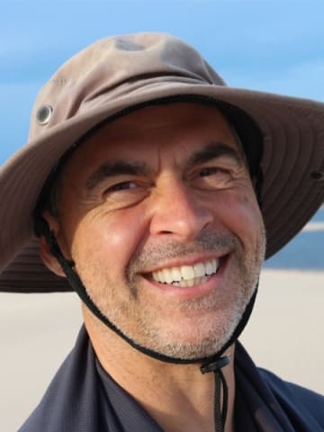 Happy Man Smiling On Beach