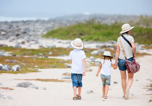 Family walking on Galapagos beach