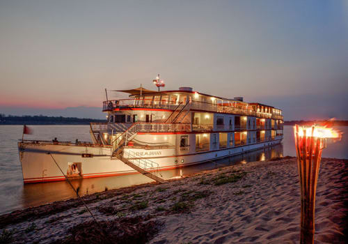 Jahan by the river bank at night