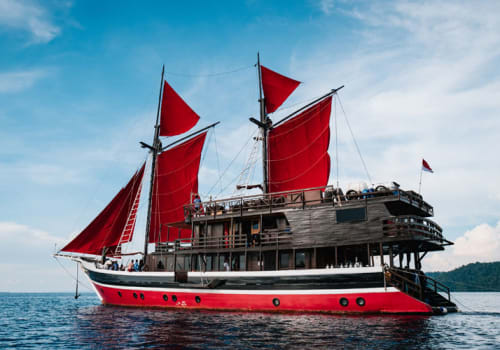 Yacht with red sails