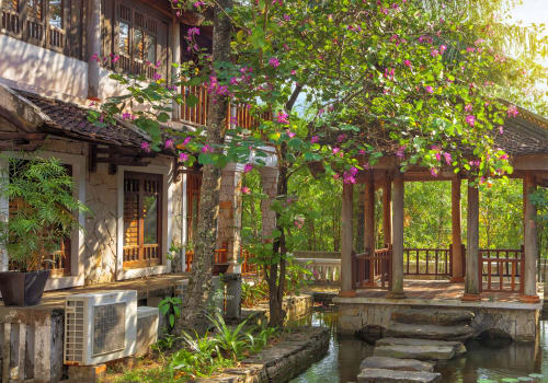 hotel surround by trees and flowers