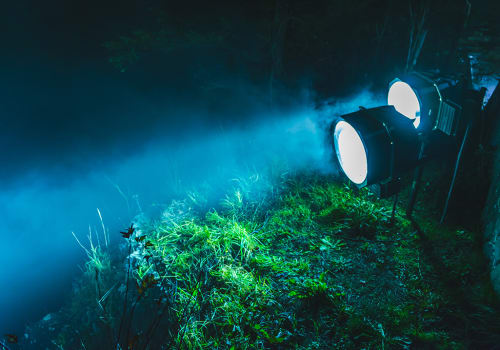 Spotlights Illuminate In The Forest At Night