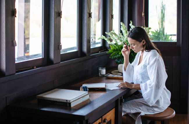 Woman reading by the window