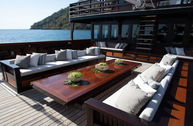 Sofas and a table on the open deck