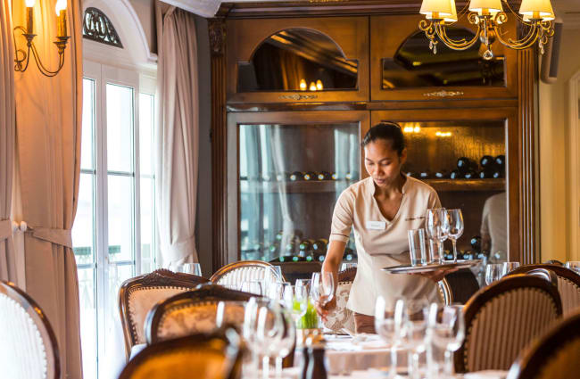 Waitress setting up the table