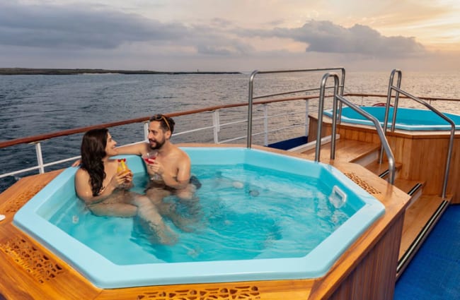 A couple in the outdoor Jacuzzi