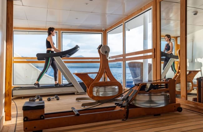 Woman exercising at the onboard gym