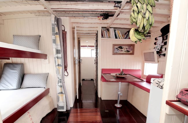 Interior with bunk beds and a reading area