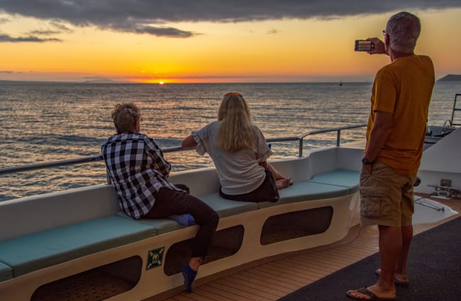 People looking at sunset