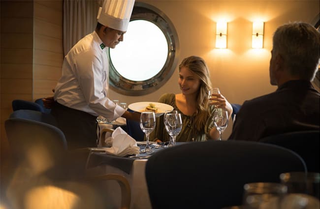 Chef talking to a passenger at the indoor restaurant