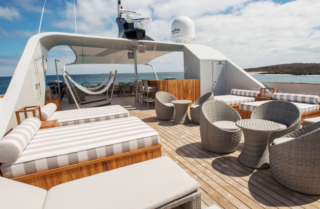 Lounge chairs and tables on the deck