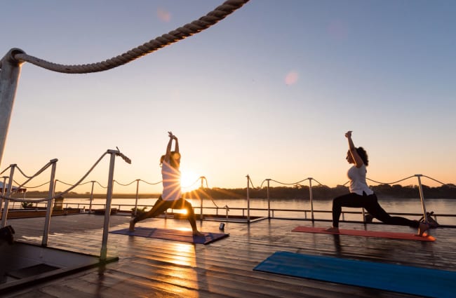 People doing yoga on the deck