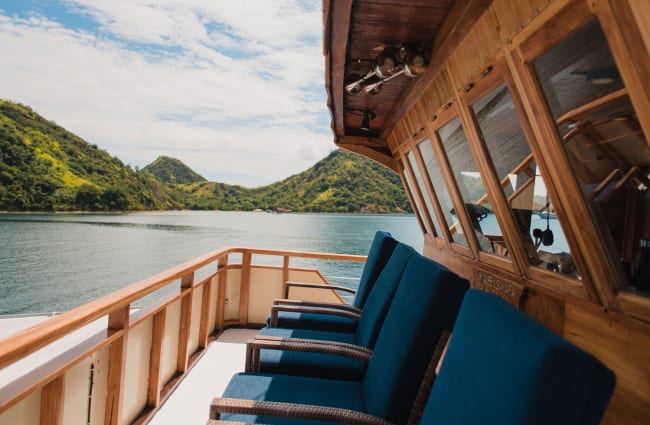 Chairs on front of the boat's bridge