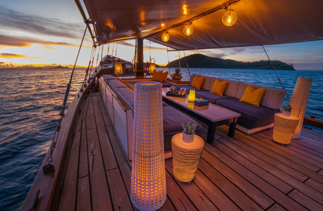 Front deck with sitting area at dusk