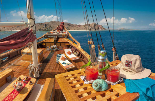 Tables and sun beds on the bow deck