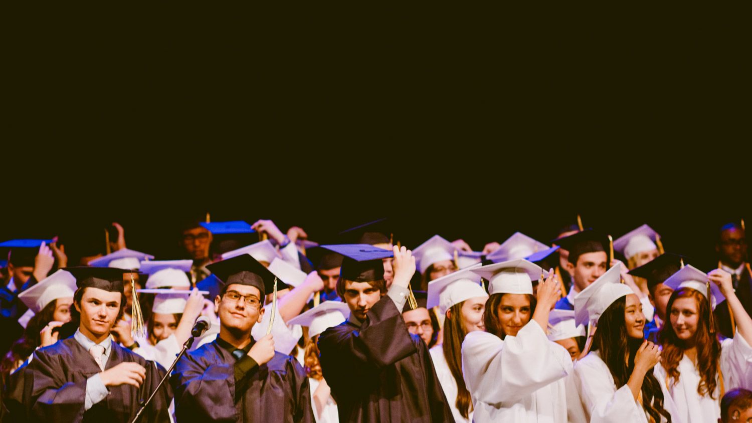 Graduating class in caps and gowns.