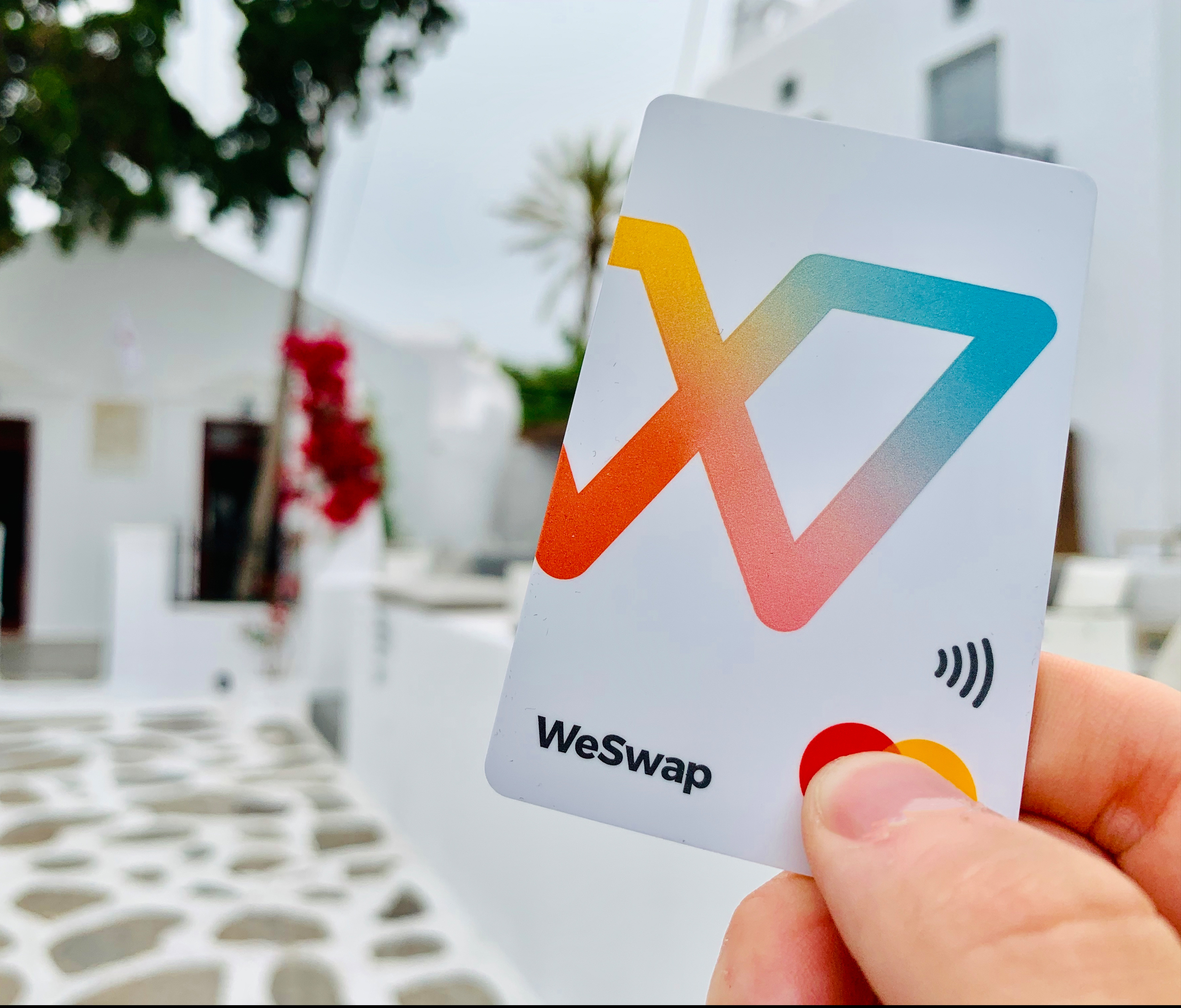 person holding a weswap credit card