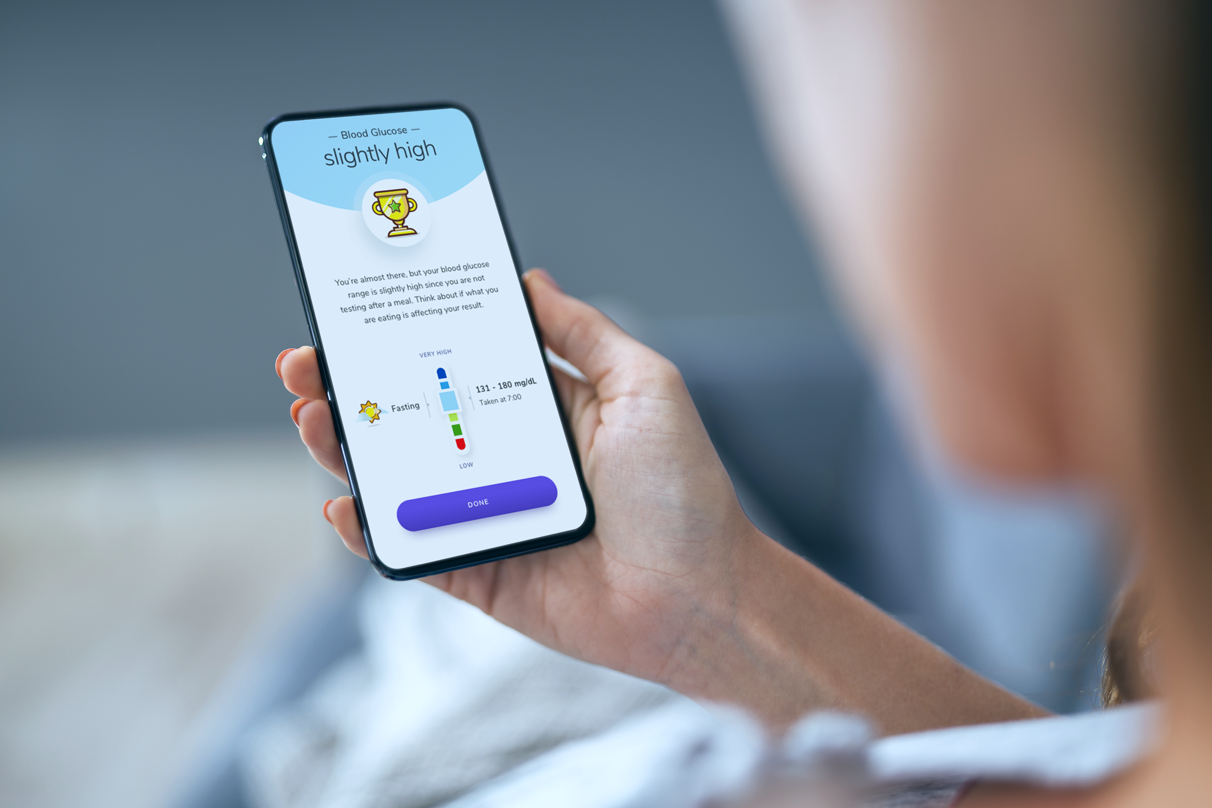 person looking at blood glucose reading on their phone