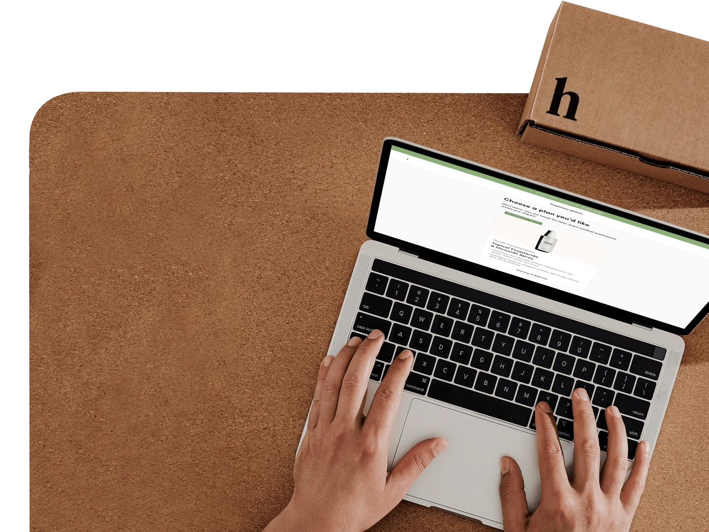 Hands typing on a keyboard looking at hims.com