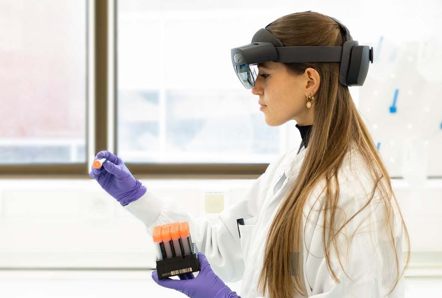 sanofi girl in pharmaceutical lab looking at samples