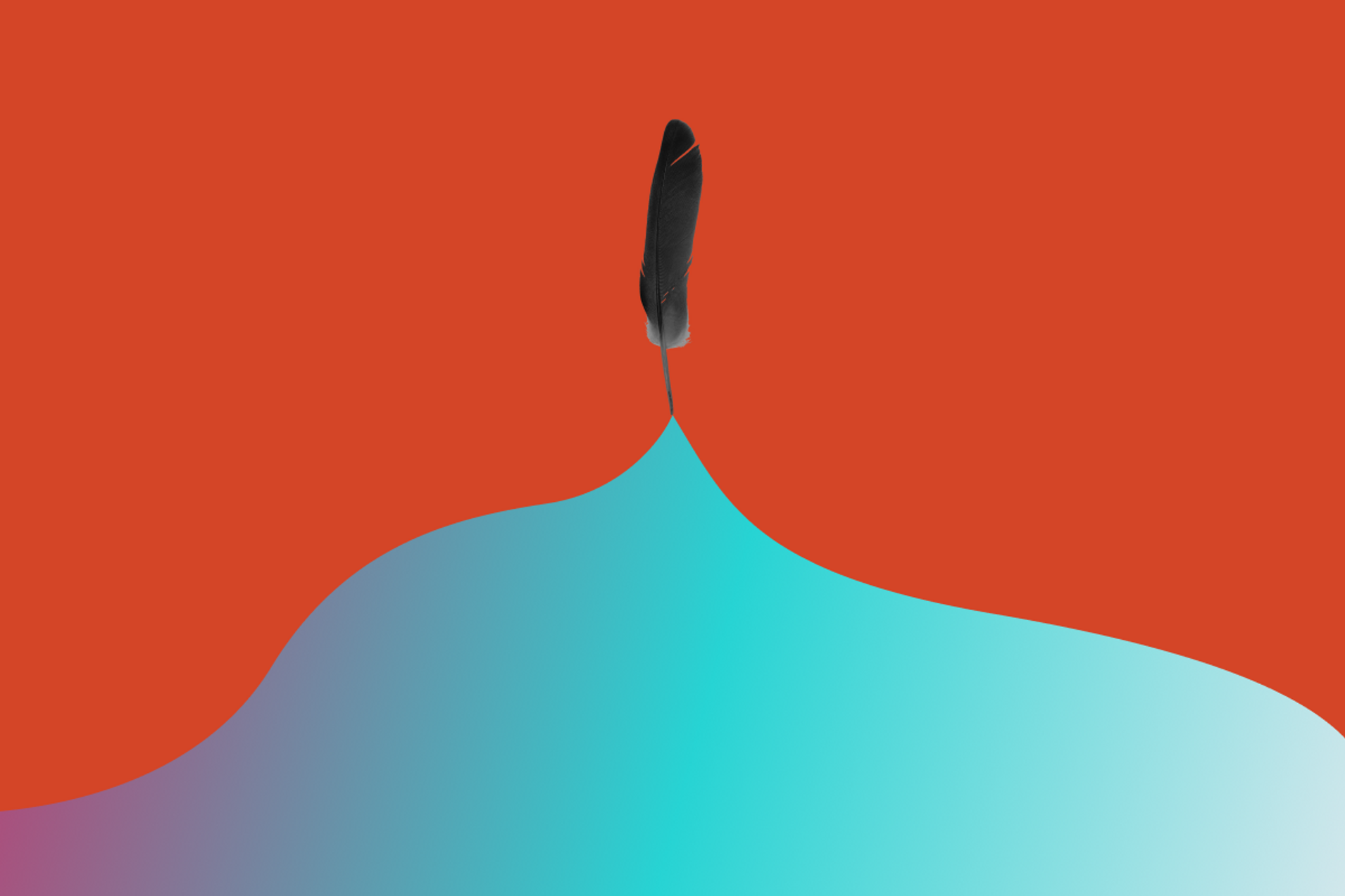a feather pen on top of a mountain