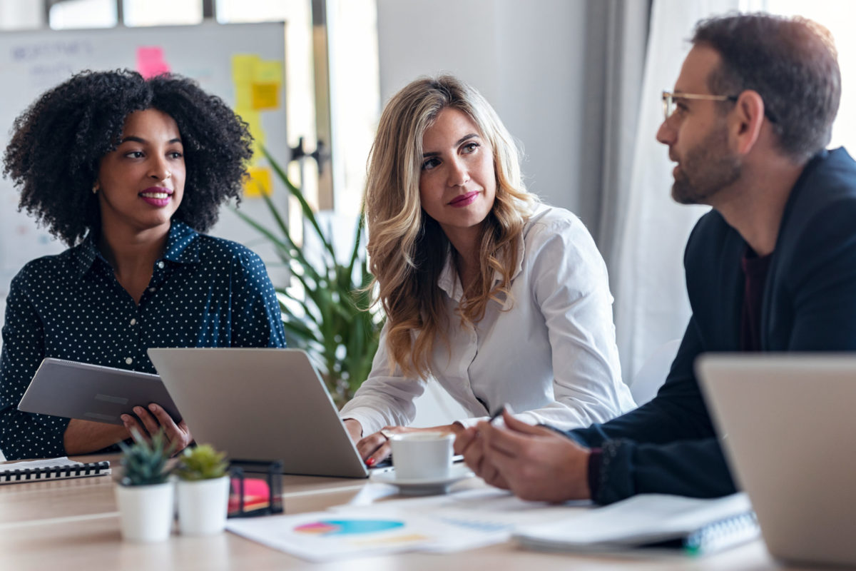 Three Varis team members in a meeting